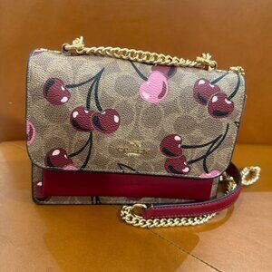 coach Mini Klare Crossbody Bag In Signature Canvas With Cherry Print cy716